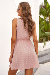 Robe sans manches à pois suisses et col noué